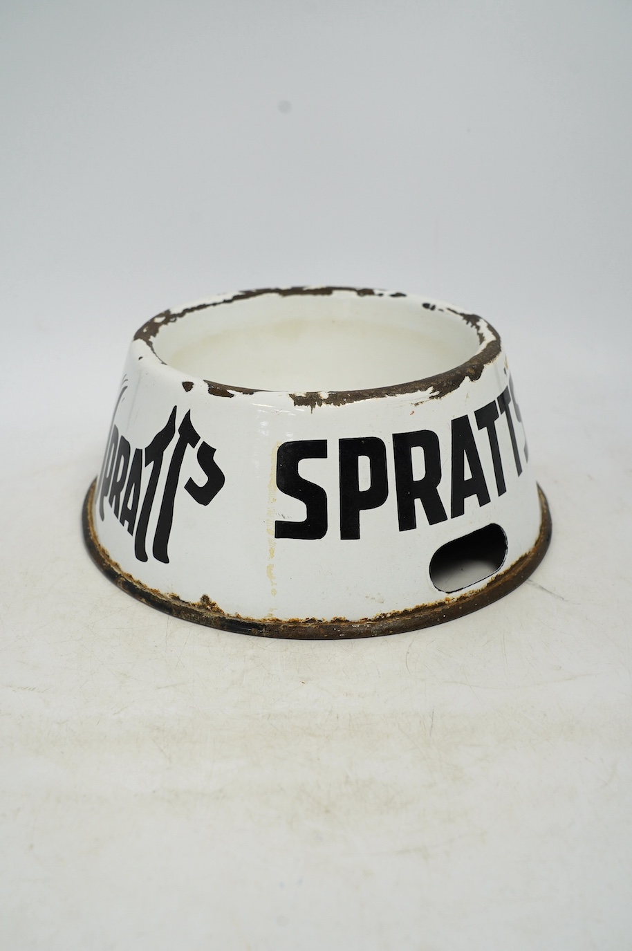 A vintage Spratt’s circular enamel advertising dog bowl, 27cm diameter, 10cm high. Condition - poor